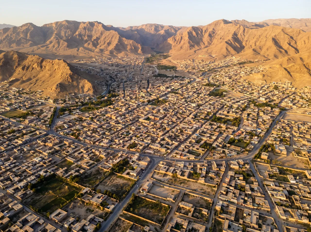 MacBook repair Quetta · aerial view of Quetta valley ringed by mountains · insured mail-in service to AppleForce Lahore